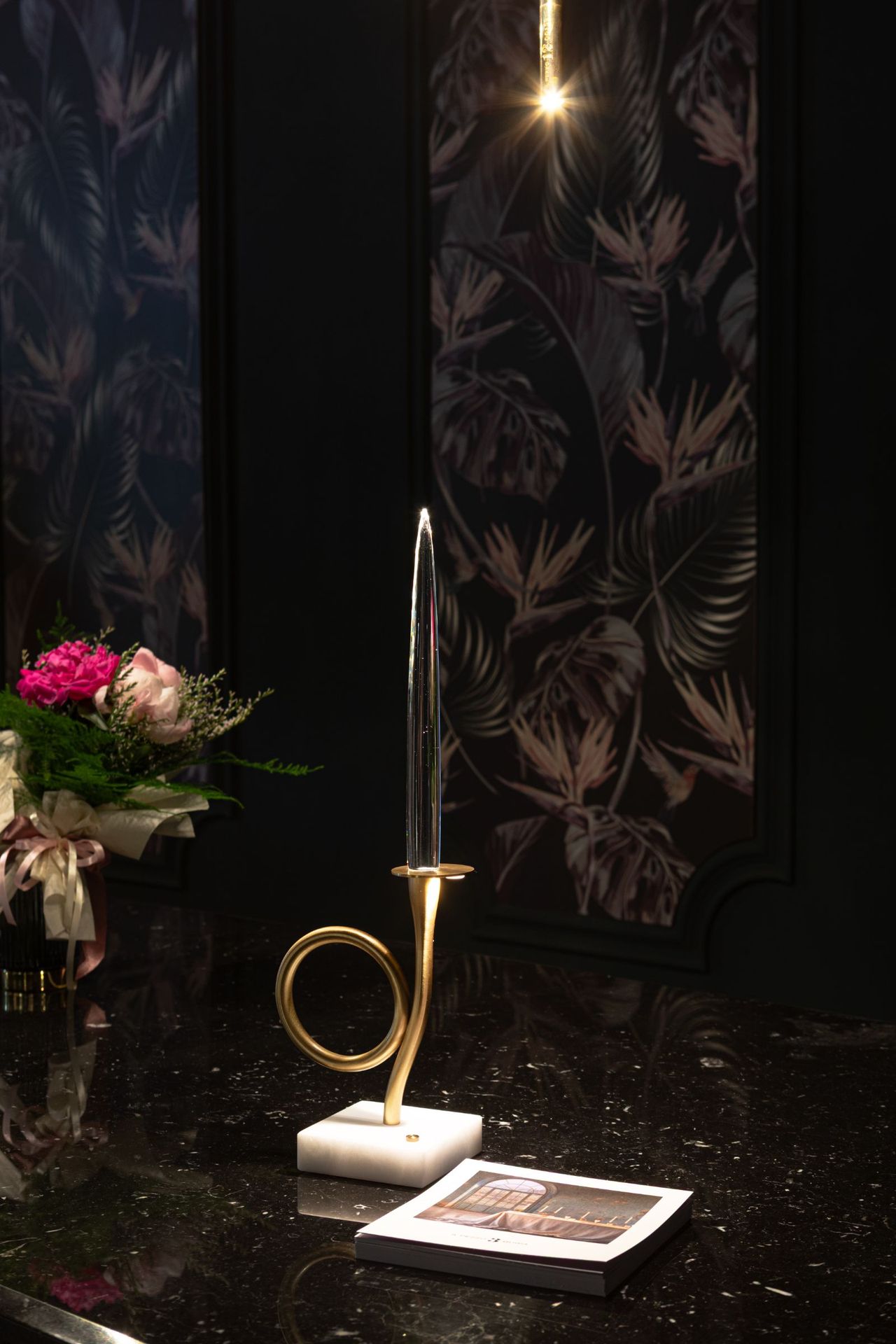 Il Pezzo 3 Bugia one-light edition lit in a dark interior