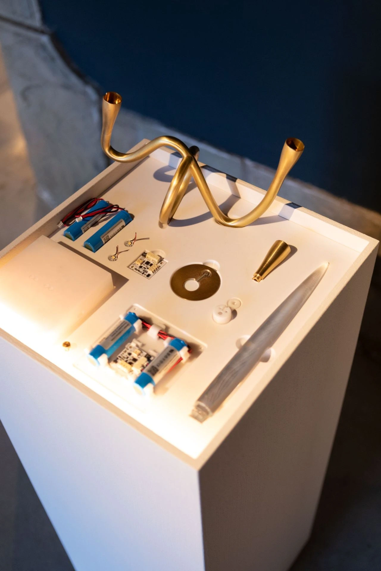 Exploded view of the components displayed on a glass case