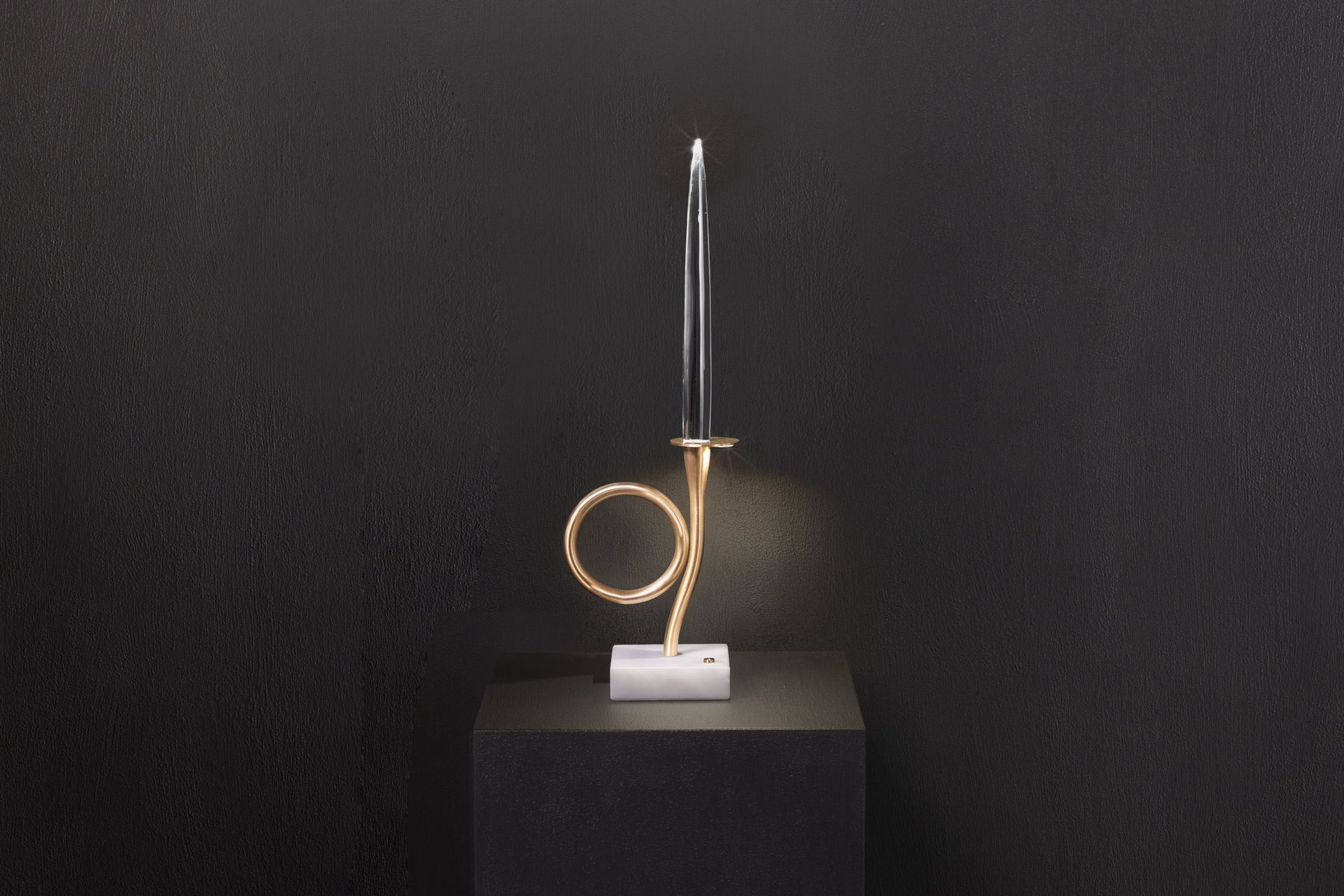 One-light edition — still life on black, front view