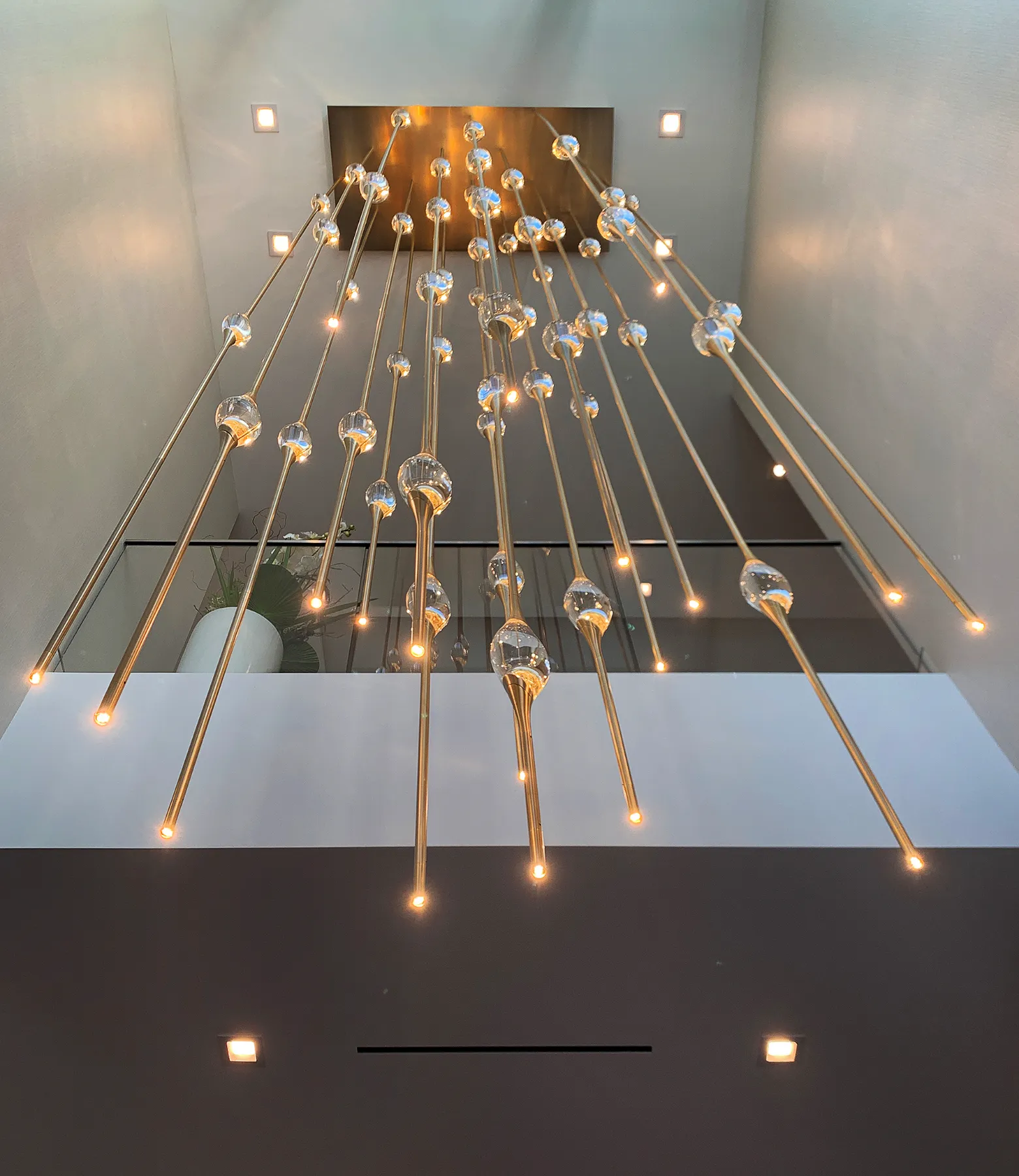 Cluster chandelier above the dining table of a Fort Lauderdale mansion
