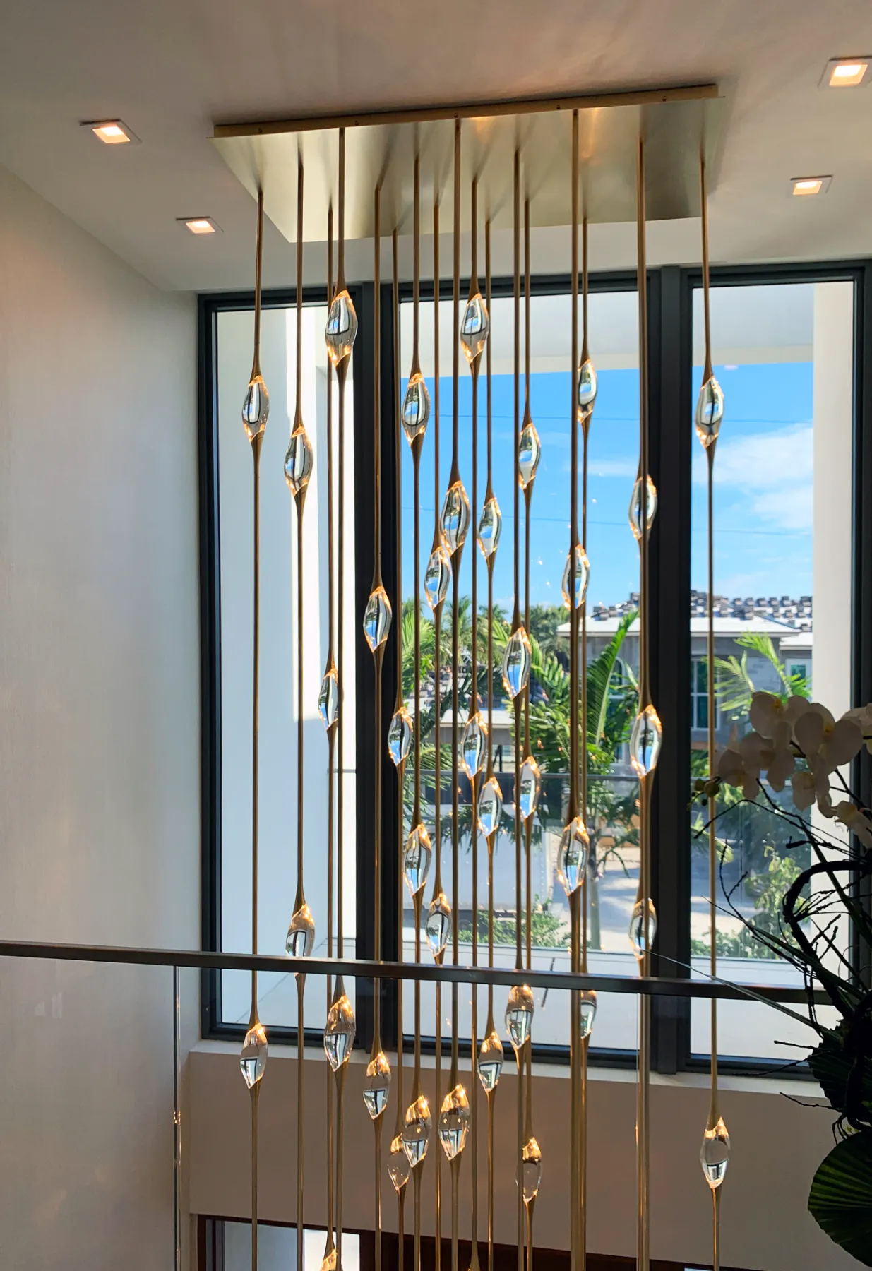 Cluster chandelier against the light in a Fort Lauderdale mansion