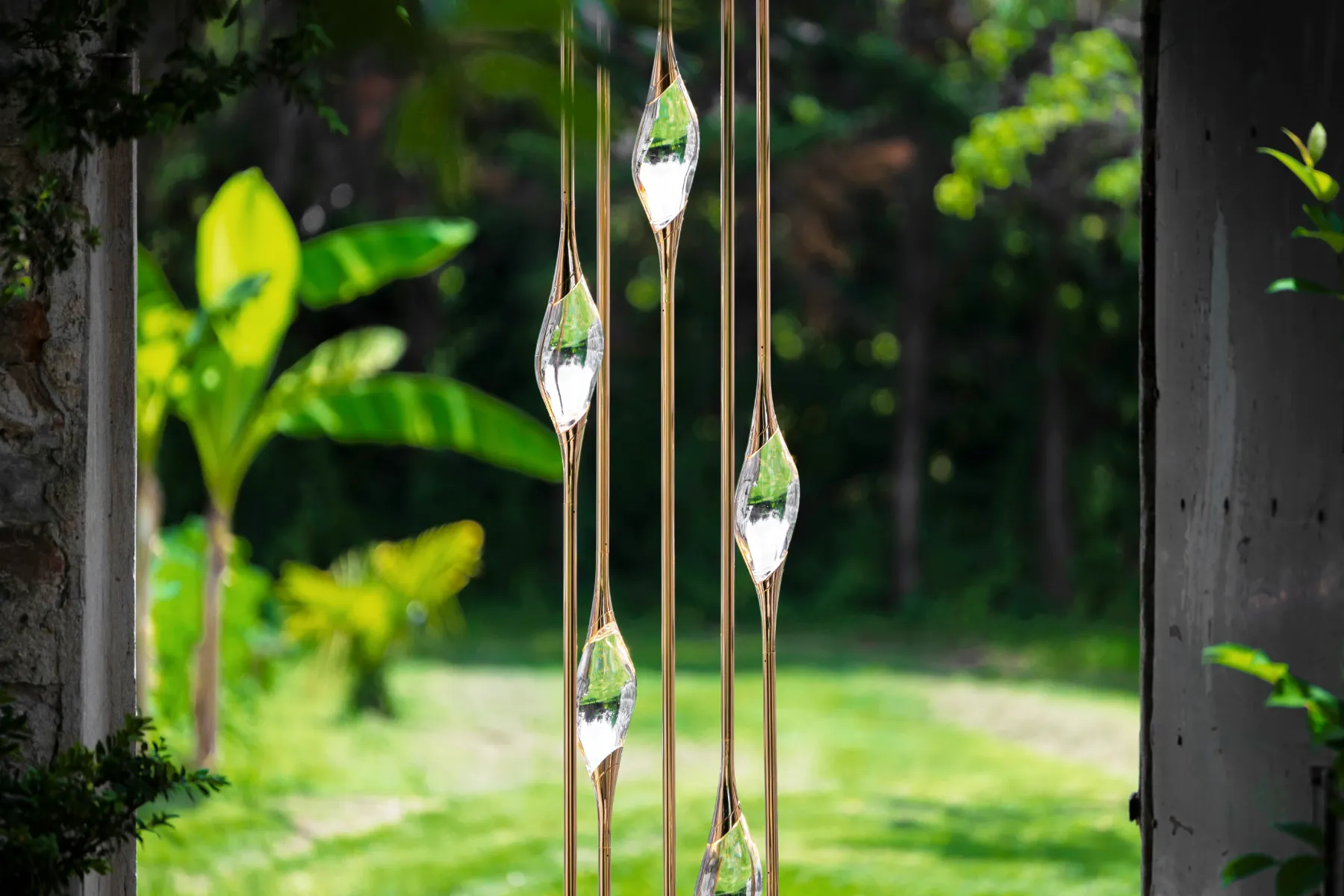Solid crystals of the Cluster chandelier reflecting the garden