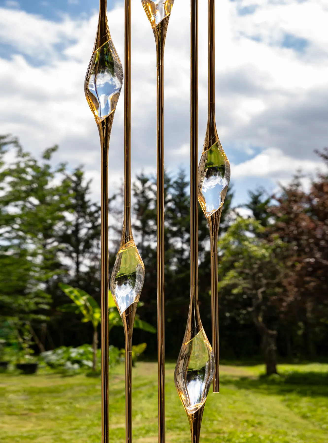 Cluster chandelier crystal against the light, capturing the sky