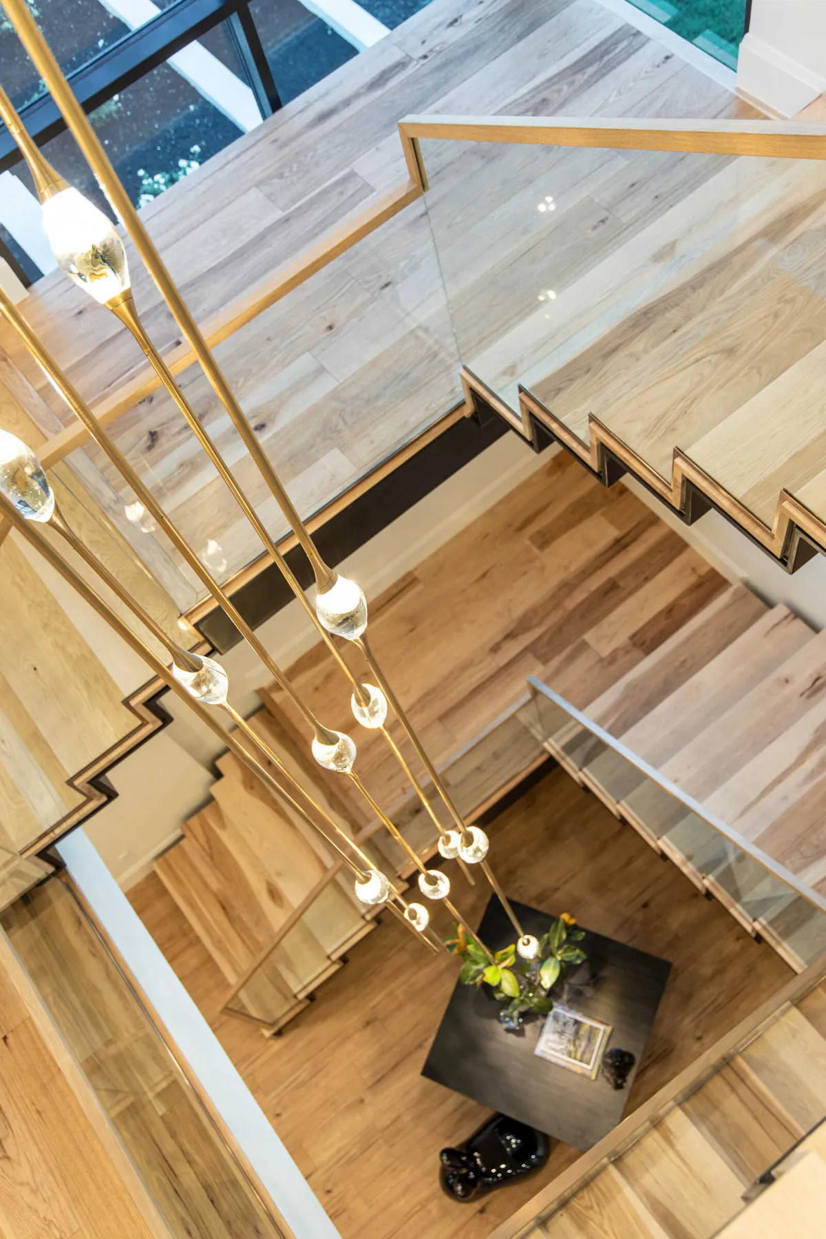 Cluster chandelier in the double-height living space of The Baccarat by Raykon Construction, Utah Valley