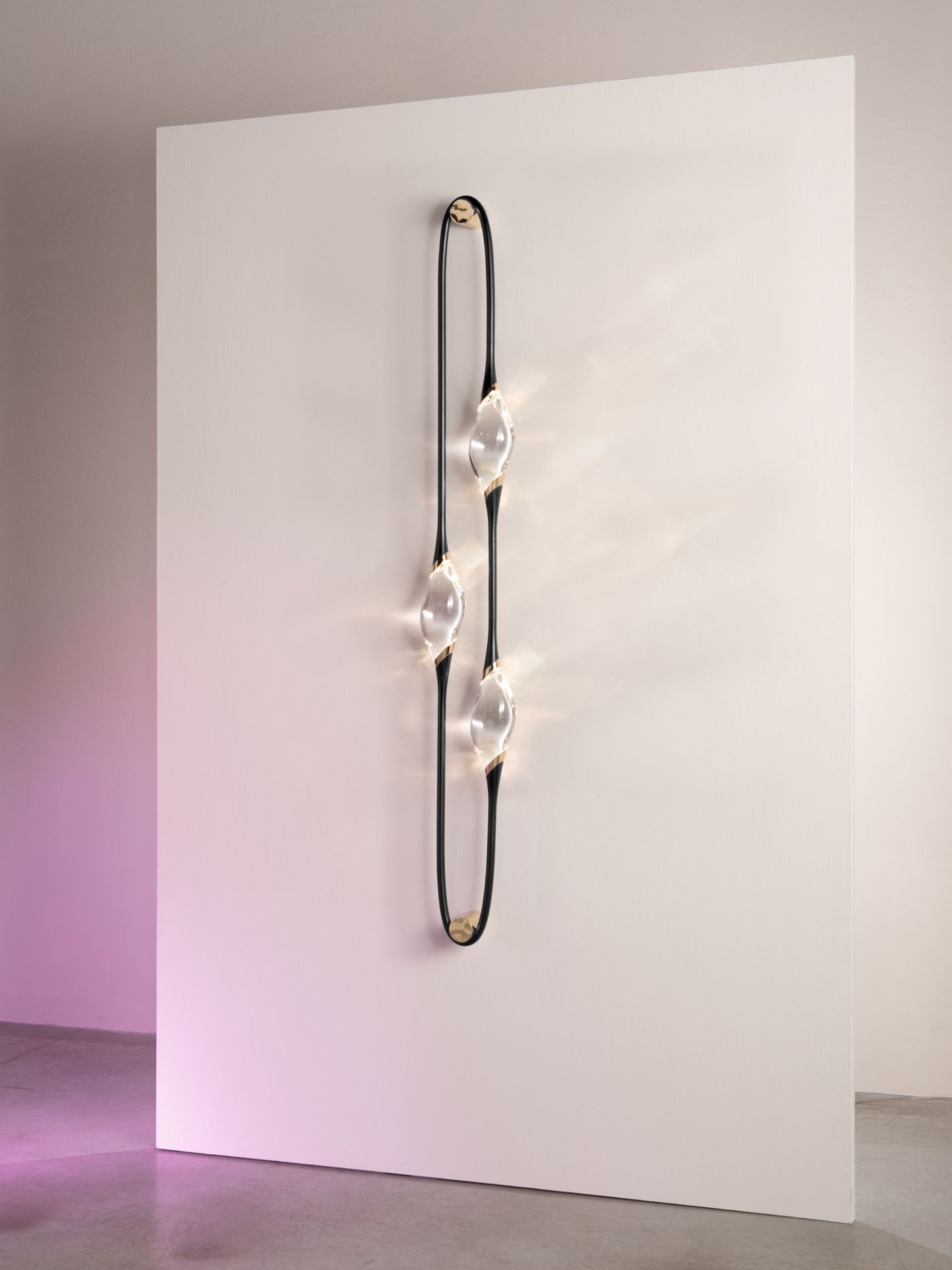 Il Pezzo 12 Wall Sconce with three crystals, lit, three-quarter view