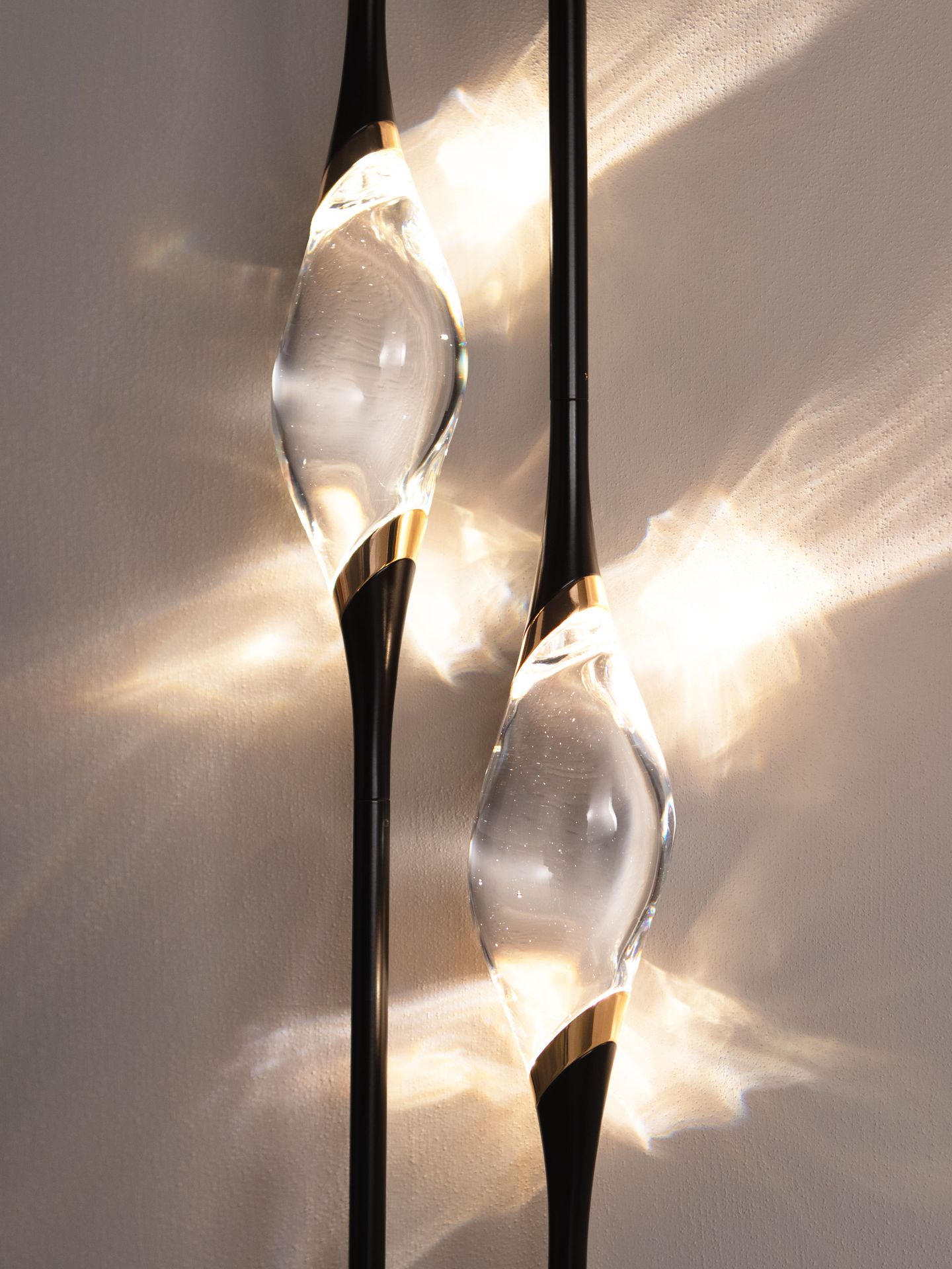 The lit crystals cast reflections of light across the wall