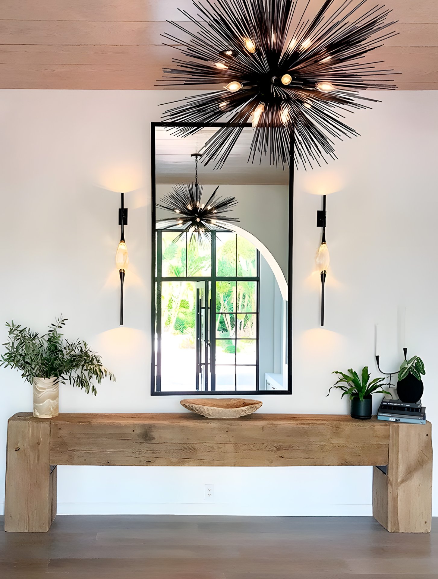 Two Il Pezzo 12 Wall Sconce at the sides of the mirror in the entrance of a San Diego villa