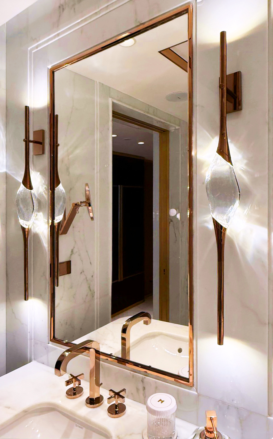 Il Pezzo 12 Wall Sconce lit beside the mirror, suite of the Royal Mansour Casablanca
