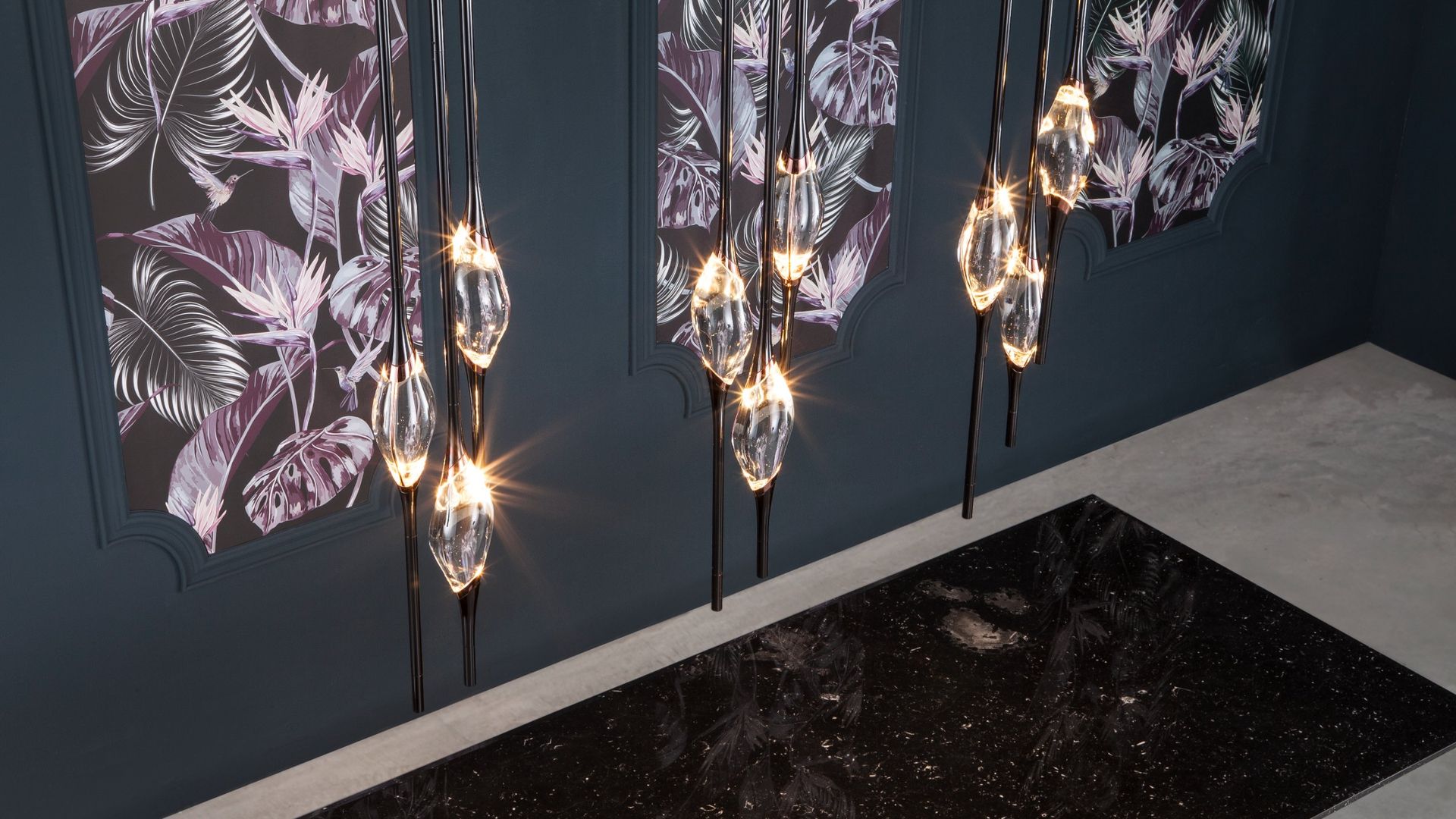Il Pezzo 12 Round Chandelier, lit, over the Il Pezzo 8 marble table